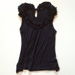 Cute ruffle neckline knit top sleeveless. Size L