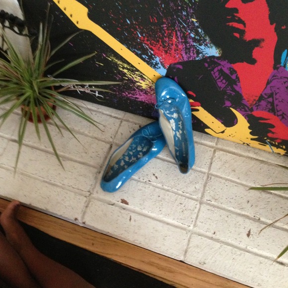 Teal flats sold at Garage Sale