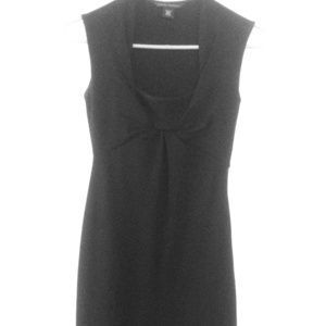 Tight, tea length black dress