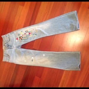 Light blue jeans with peacock design