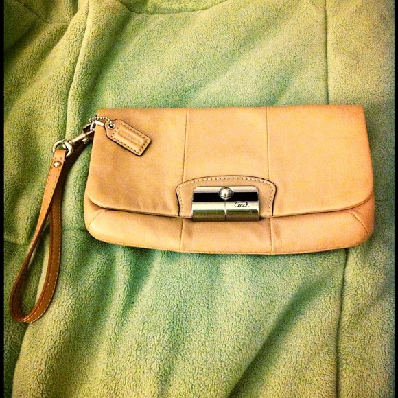 USED ONCE. Nude coach clutch or wristlet