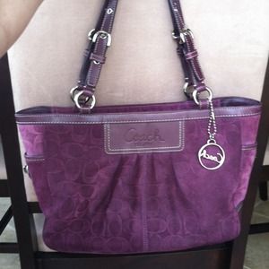 Plum suede Coach purse.