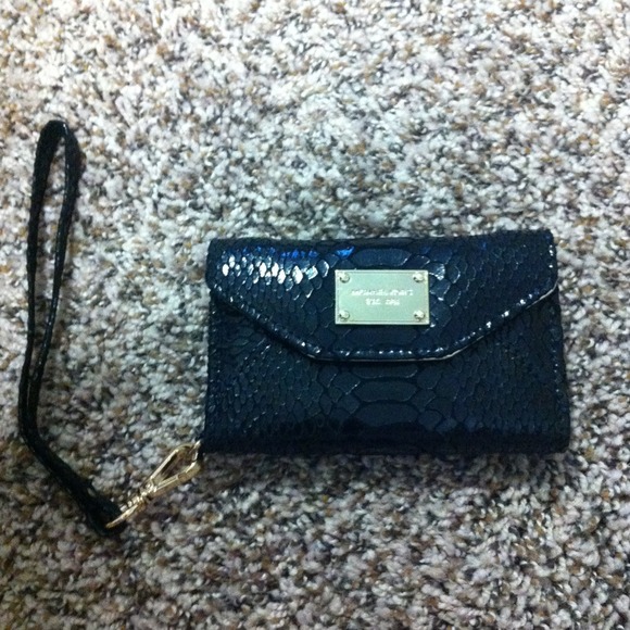Michael Khors black wristlet.
