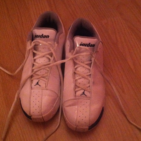 White with navy Jordan women's sneakers.