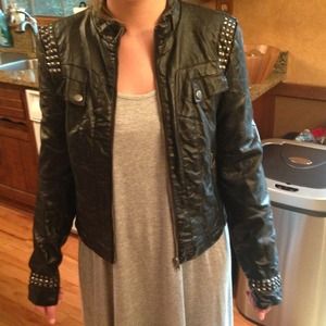 A black faux leather jacket with silver studs