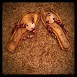 Flat beachy sandals.