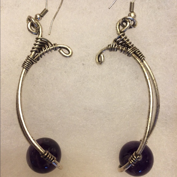 Accessories - Purple orbs suspended from silver tubes earrings.