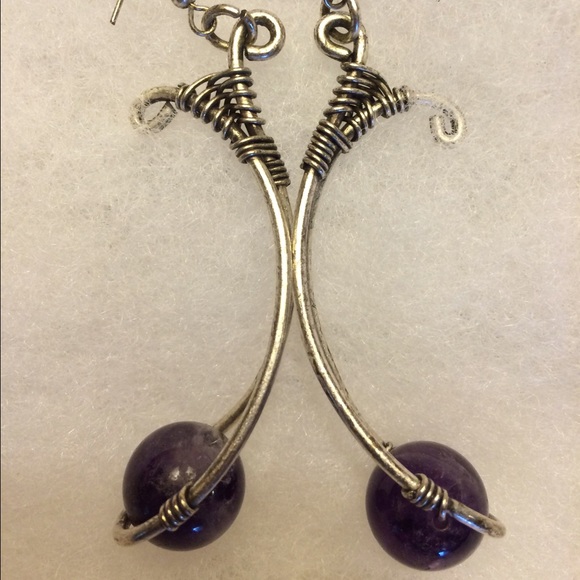 Purple orbs suspended from silver tubes earrings. - Picture 3 of 4