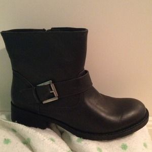 Black leather ankle boots with buckles on the side