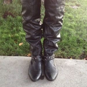 Knee-high black studded boots