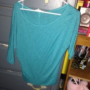 Teal shirt.