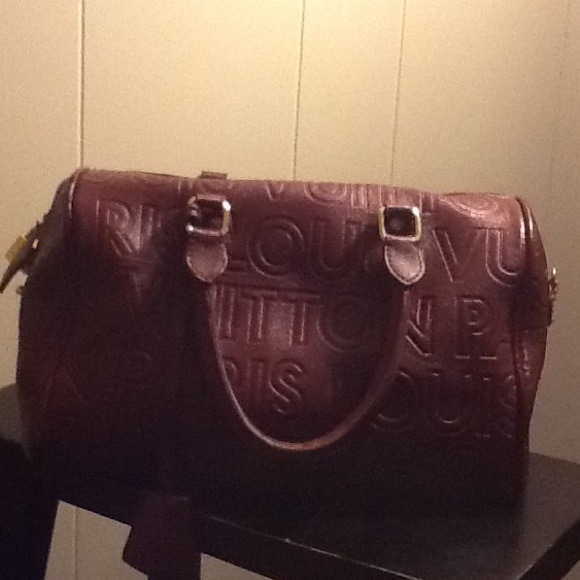 Burgundy Louis Vuitton handbag