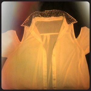 A button-up , beaded collar shirt