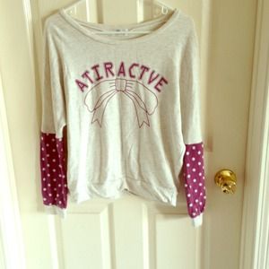 Printed top with polka dot sleeves.