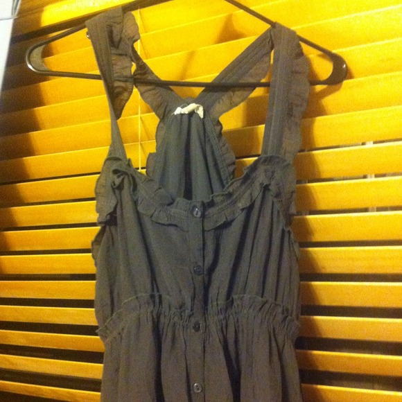 A gray dress with lace on the bottom