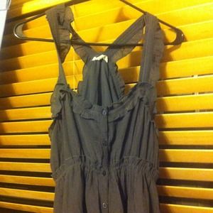 A gray dress with lace on the bottom