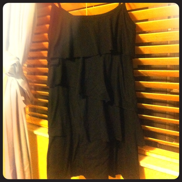 A short black spaghetti strapped Ruffled dress