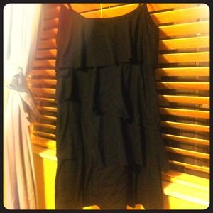 A short black spaghetti strapped Ruffled dress