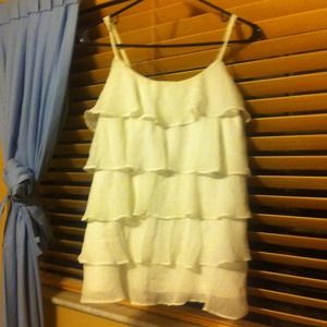 A Ruffled white and gold shirt