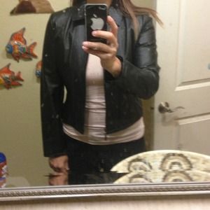 Leather jacket, no pockets very feminine.