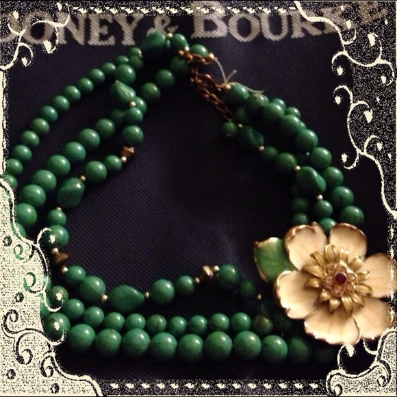 Gently used three strand necklace with flower