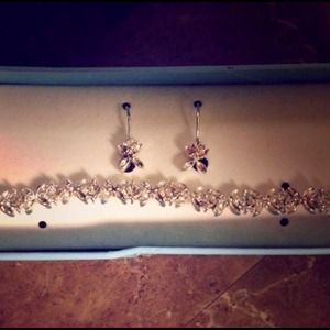 Still in box, bnwot! .925 bracelet and earrings.