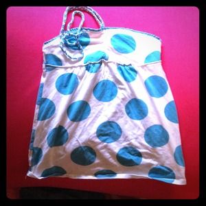 A kids shirt. Ties around neck. Perfect for summer