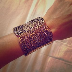 Gold cuff bracelet with rosé detail