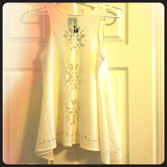 Fun, flowy white tank with laser-cut detailing!