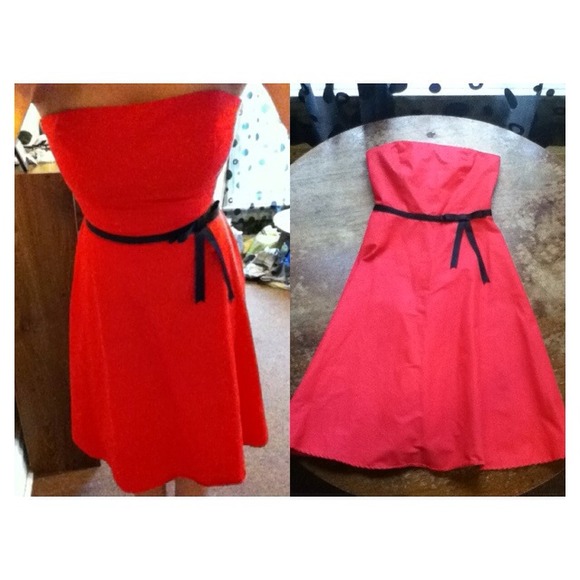 Red strapless dress with black ribbon