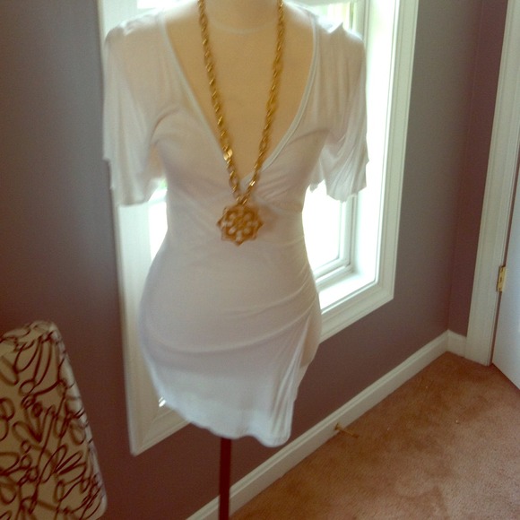 Brand new low cut white dress. 👗