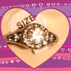 New silver ring with diamond style stone