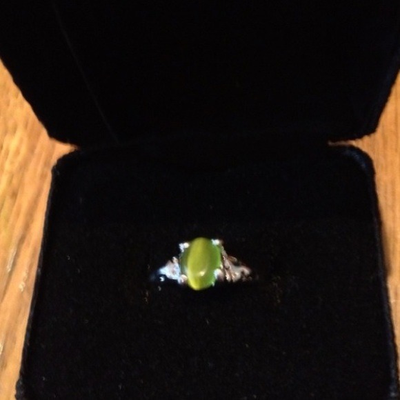 Silver rings with green smooth stone