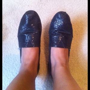 Glittery black Toms.