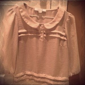 Cream 3/4 sleeve top with rounded collar