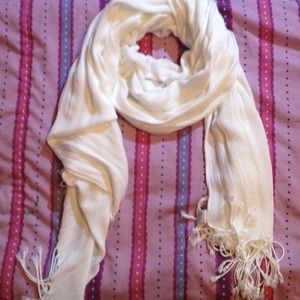 A beige/white scarf it can also be used as shaw ..