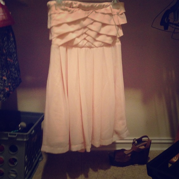 Pale pink strapless dress.