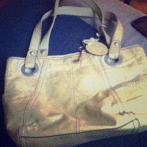 A medium yellow 'fossil' brand purse