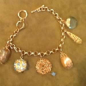Gold charm bracelet.