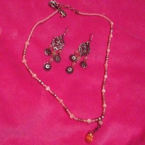 Peach and silver earrings and a peach necklace