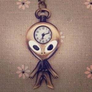 Alien watch necklace.