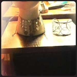 Heart necklace with a bulky bracelet both silver