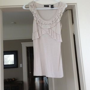 A fun criss-cross ruffle front tank top!