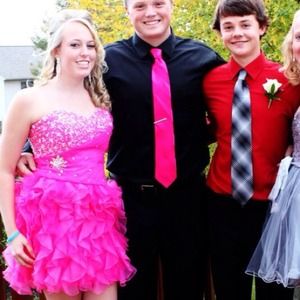 The pink dress on the left. It is a Mori Lee gown.