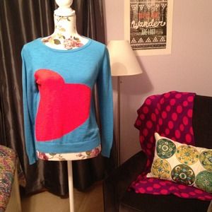 Blue sweater with a red heart