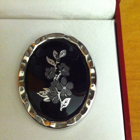 Black and silver brooch