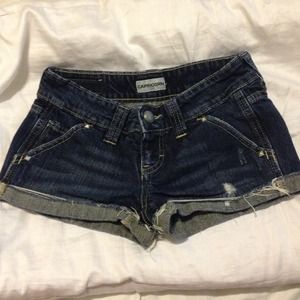 Blue denim shorts with silver studs