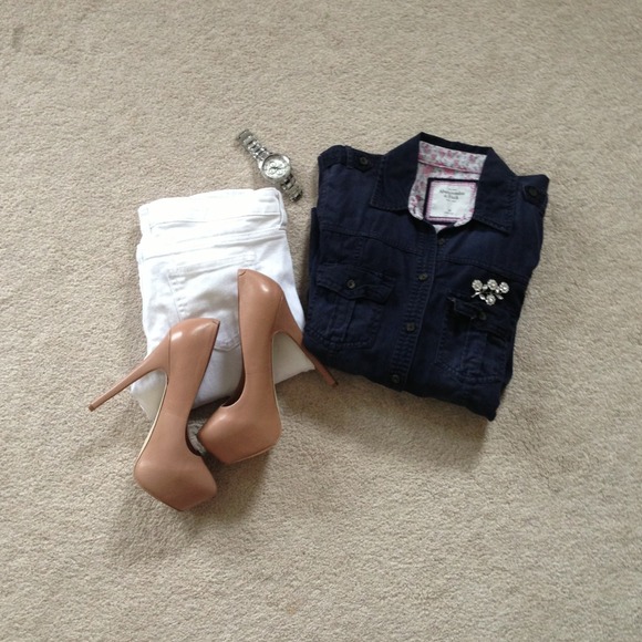 navy blue top and pin.