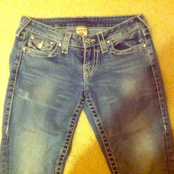 True Religion pale wash jeans.