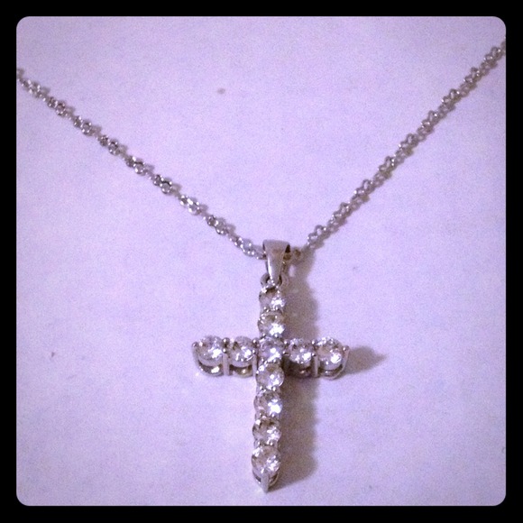 Platinum over sterling silver cz cross pendant.